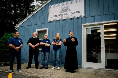 Clergy and lay leaders stand outside the Neighbors Being Neighbors Food Pantry (Photo: Girl in a Camera Productions)