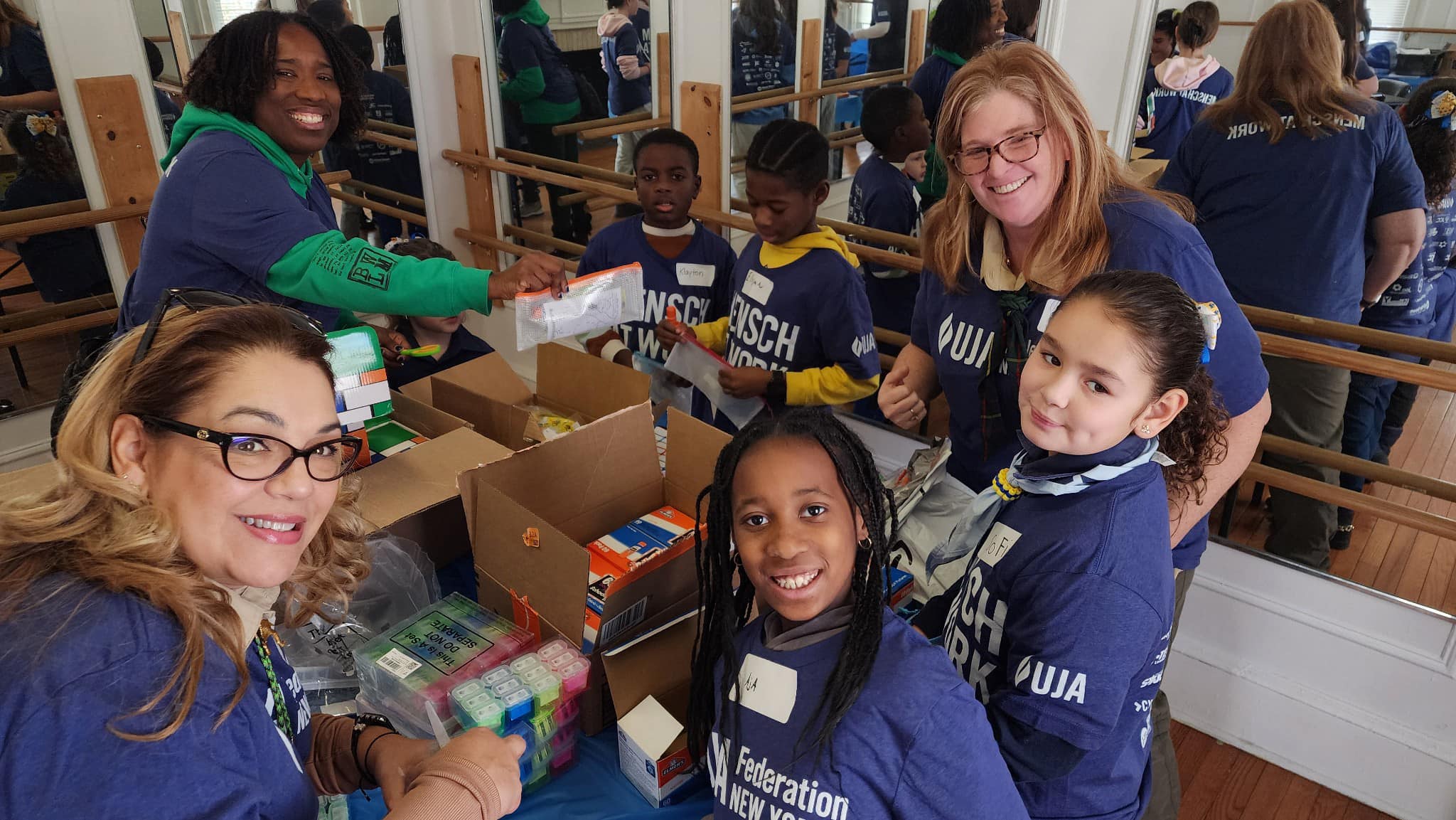 Volunteers pack pre-school resource kits at the Gural GCC