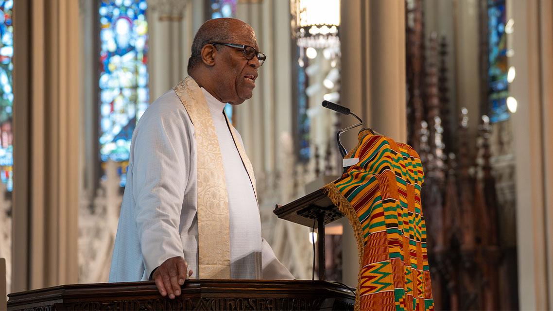 Canon Davis delivers sermon in the pulpit of the Cathedral