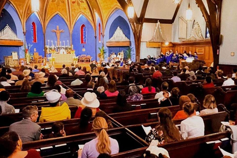 A bustling congregation fills the nave at St. John’s Park Slope.