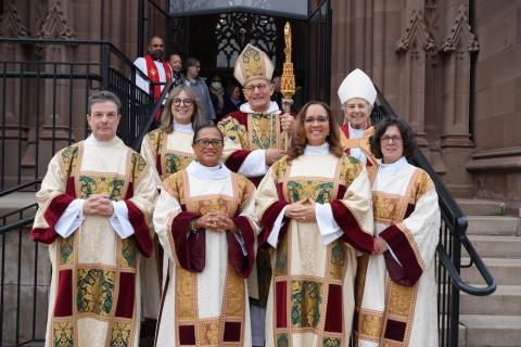 Newly ordained deacons stand outside the Cathedral of the Incarnation with Bishop Provenzano